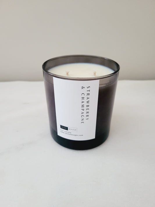 soy candle scent strawberry and champagne in black smoke vessel with 2 wicks